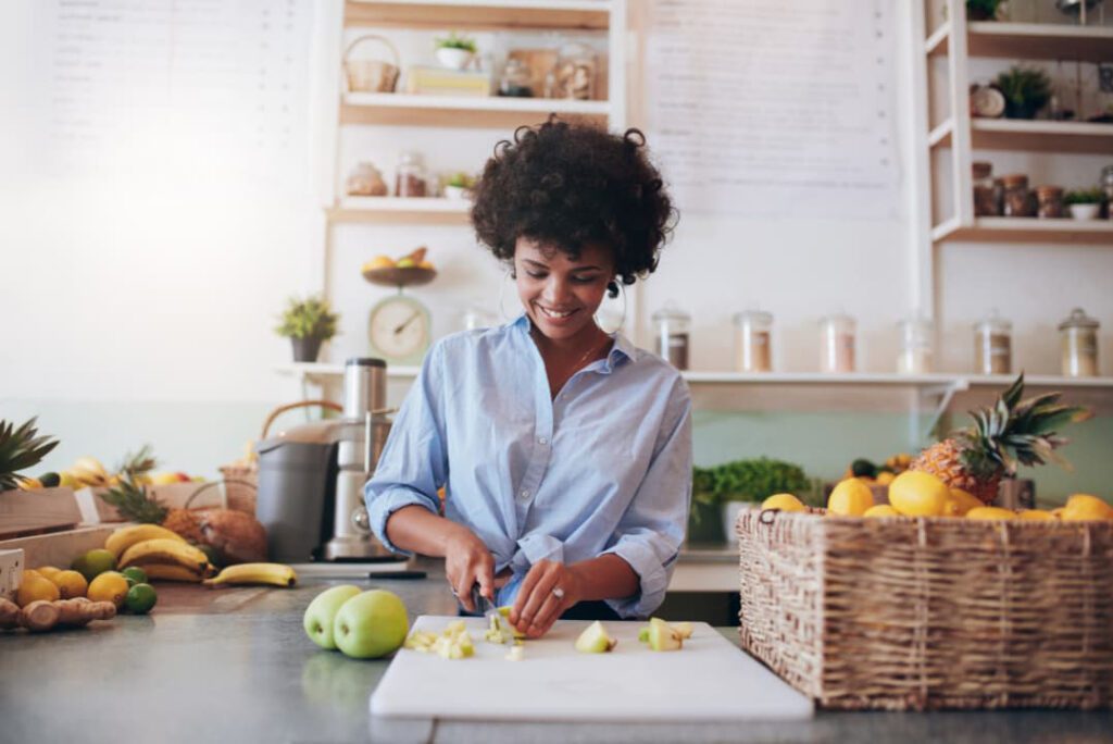 A woman preparing detox drink for clear skin