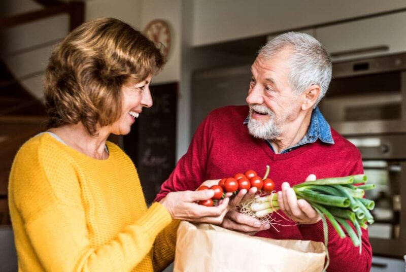 couple unpacking groceries